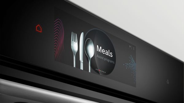 Дисплей на фурна Bosch в близък план, показващ "Meals Assist programs" с икони на прибори за хранене.