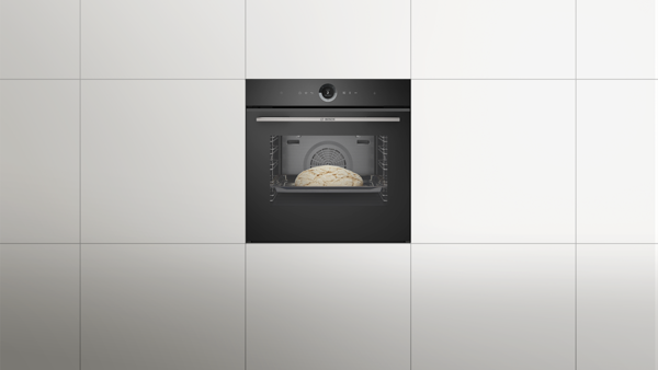 Bosch sobası; i&ccedil;ərisində qabaran &ccedil;&ouml;rək var və ekranda bişirmə parametrləri g&ouml;stərilir.