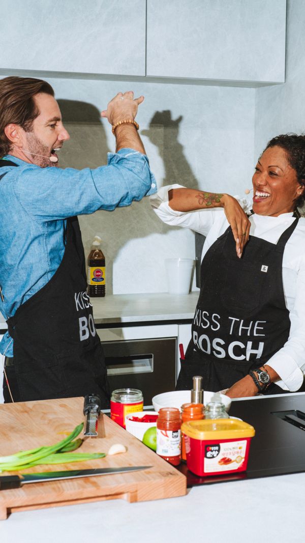 Chefs cooking with Bosch in kitchen