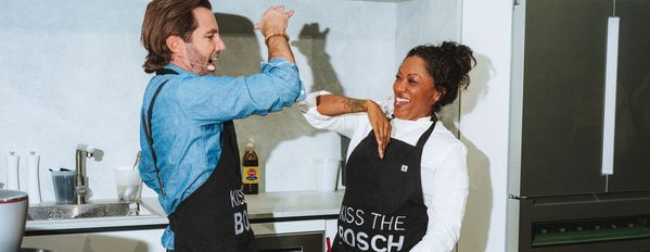 Chefs cooking with Bosch in kitchen