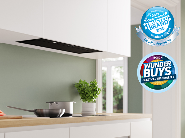 Slim black Bosch integrated rangehood above cooktop 