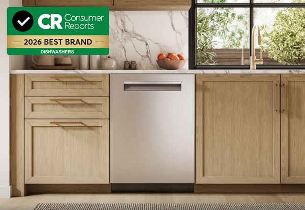 Bosch stainless steel dishwasher with white oak cabinet kitchen and Consumer Reports logo