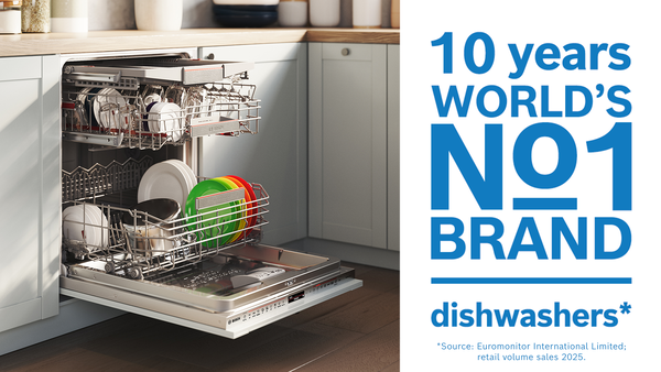 Bosch dishwasher with door down and inside drawers filled with dishes partially pulled out