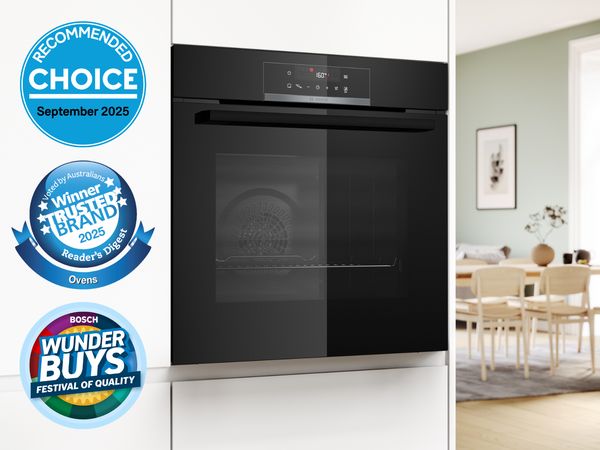 Bosch built-in black oven in white cabinetry with Choice and Reader&rsquo;s Digest award.