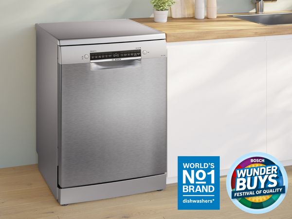 Bosch freestanding stainless steel dishwasher beside a sink and timber benchtop with World&rsquo;s No.1 dishwashers badge.    