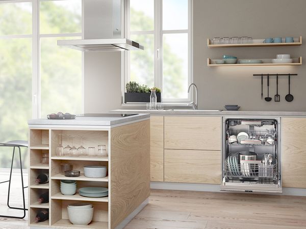 Buanderie moderne avec smartphone sur une table, panier de linge et deux lave-linges &eacute;l&eacute;gants.