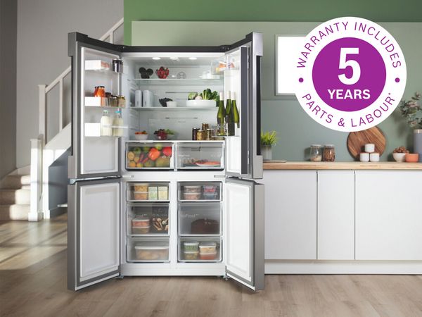 Bosch multi door fridge freezer with all doors open showing inside contents and a five year warranty icon overlay