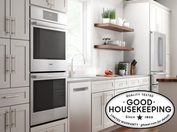 Bosch Kitchen displaying double oven dishwasher and fridge  with good housekeeping seal