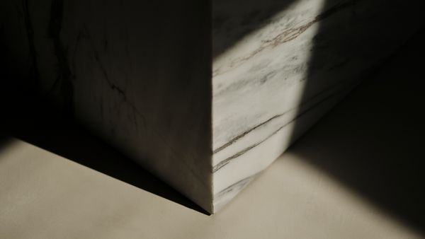 Detail shot of the locally sourced kitchen island marble and the floor 