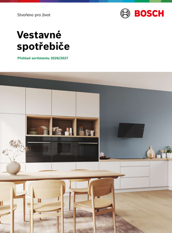 Modern&iacute; kuchyně s vestavěn&yacute;mi spotřebiči Bosch, myčkou s barevn&yacute;m n&aacute;dob&iacute;m a stylovou zelenou stěnou.