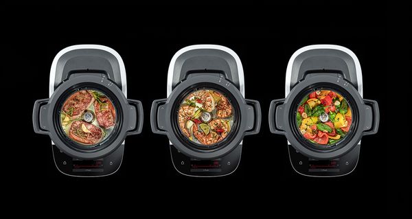 Bosch Cookit K&uuml;chenmaschine mit Kochfunktion mit drei Gerichten im Topf.