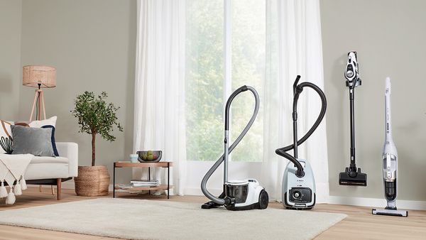Vacuum cleaners in a living room.