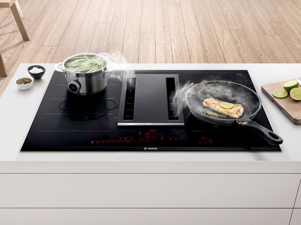Cooktop with integrated ventilation module.