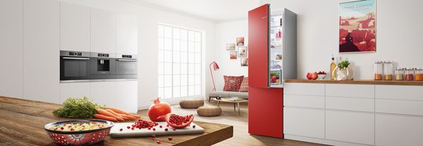 Colourful kitchen in red with coloured fridge freezer by Bosch.