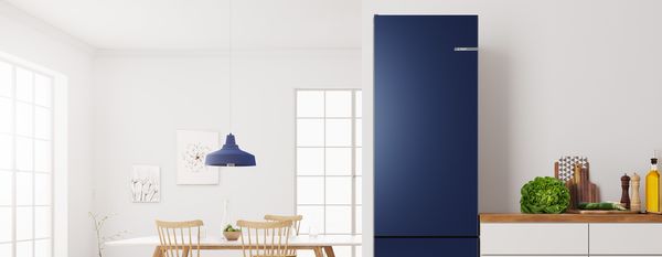 Colourful kitchen with coloured fridge freezer by Bosch.