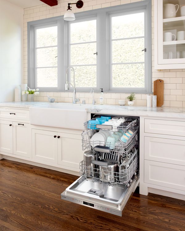 Bosch dishwasher opened with a clean set of dishes