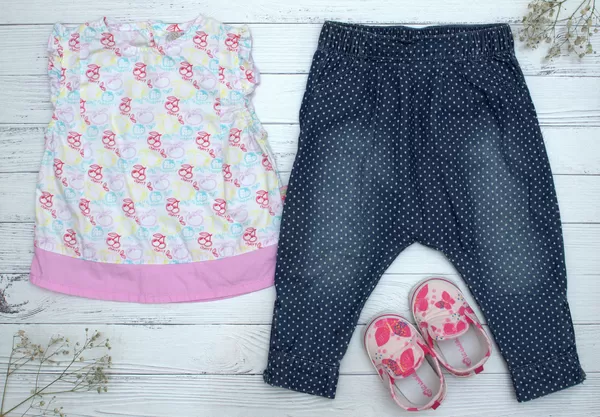 Baby clothes top, trousers and pair of shoes