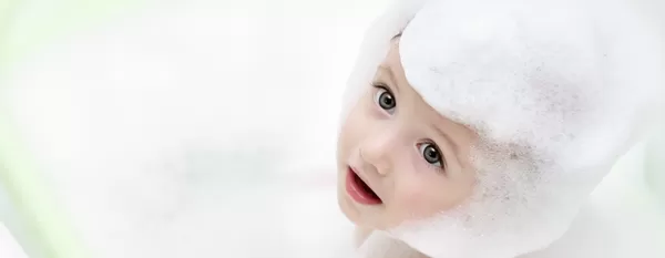 Baby in a bath with foam