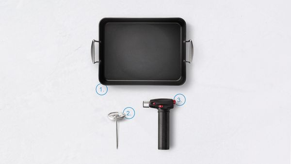Casserole dish, thermometer, and blowtorch