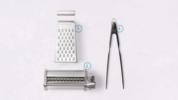 Graters, pasta maker, and kitchen tongs
