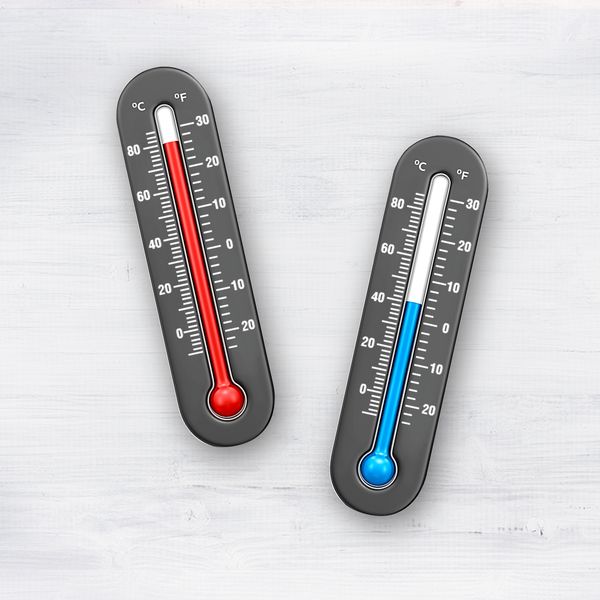 Two traditional thermometers one showing a red warmer temperature and the other a blue cooler temperature