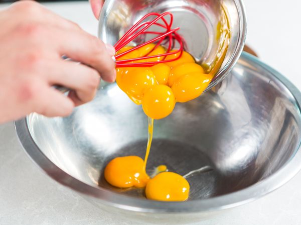 Add egg yolks, corn flour and white sugar in a mixing bowl and mix them well
