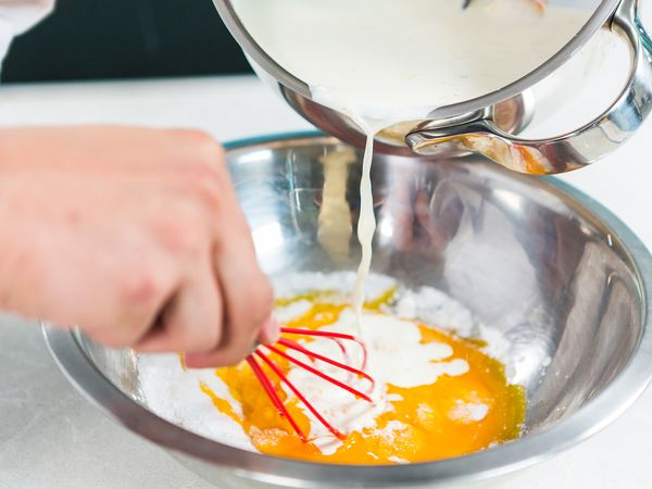 Pour in the cream mix in step 2A to the ingredients in the mixing bowl while whisking