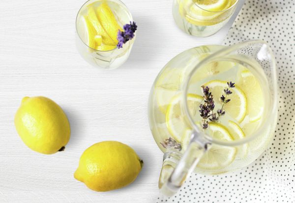 Jug of lemons and lavender in water