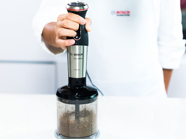 Grind the fresh black peppercorns with a hand blender