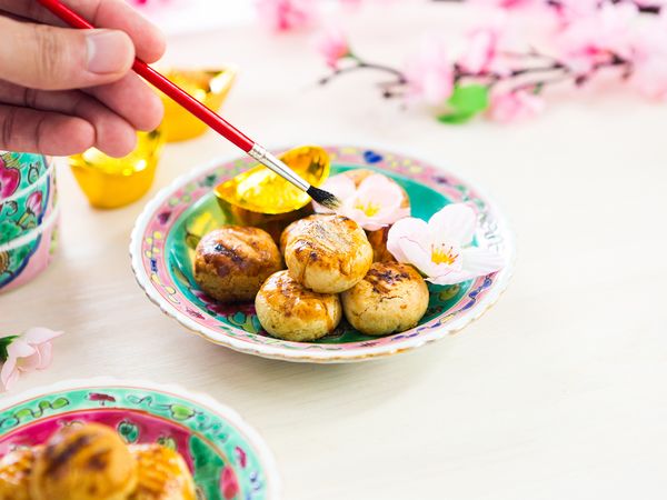 To add festive cheer, brush some gold powder onto the pineapple tarts after baking them