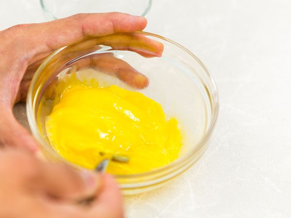 Beat the eggs, heat up cooking oil in a non-stick frying pan