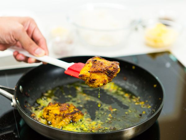 Remove chicken from pan and any excess marinade