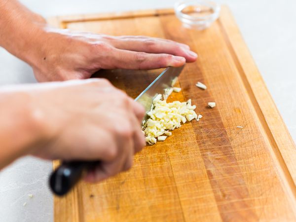Chop garlic, shallots, spring onions, and crush chilli padi