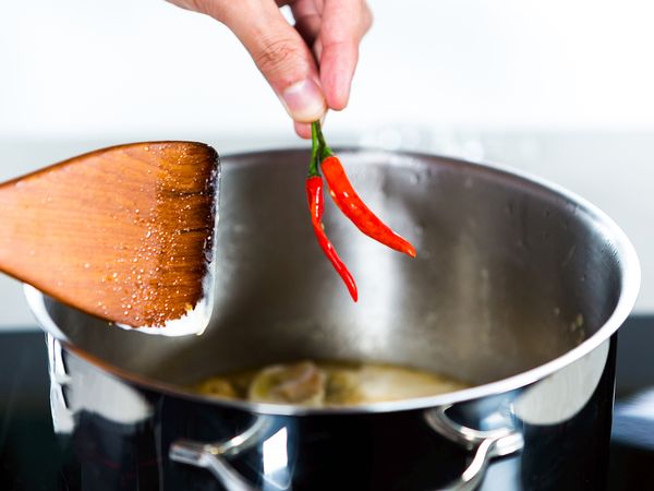Add crushed chilli padi, salt, sugar, and pepper