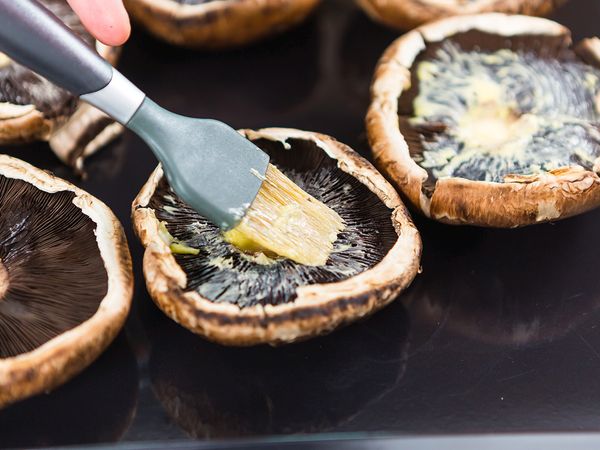 Brush the mushrooms with softened butter