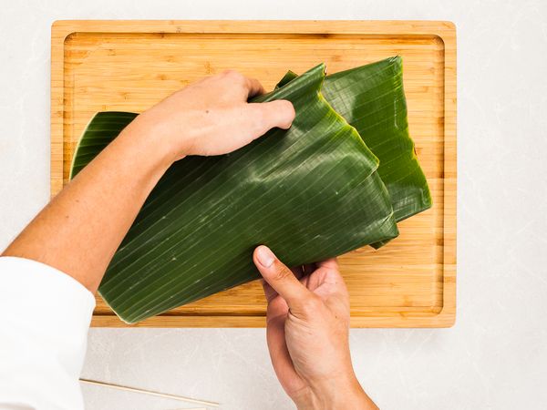 wrap the chicken with the banana leaf
