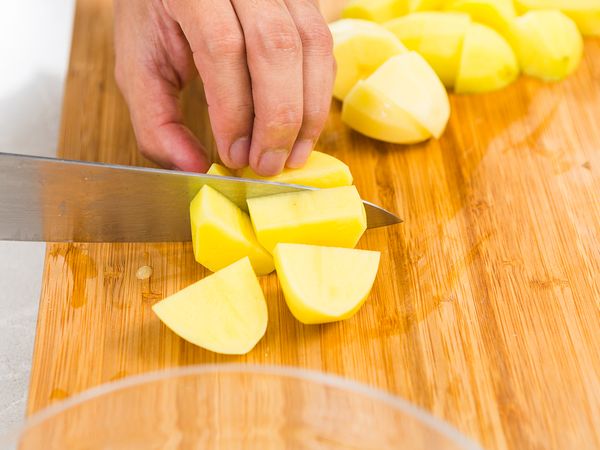 Peel and chop potatoes