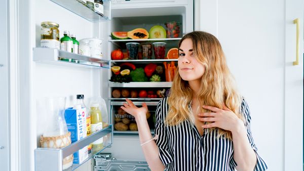 Woman showing what's in her fridge