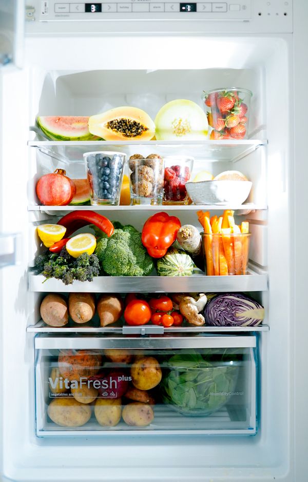 Open fridge full of food