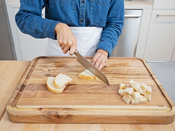 Cutting bread into small cubes