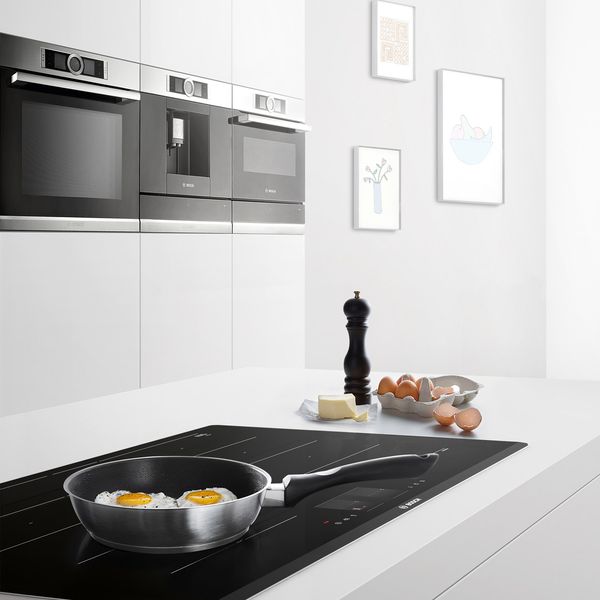 Open Kitchen with Bosch Ovens and Hob with Eggs in frying pan