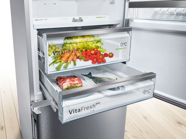VitaFresh drawers open in Bosch Fridge Freezer containing produce.