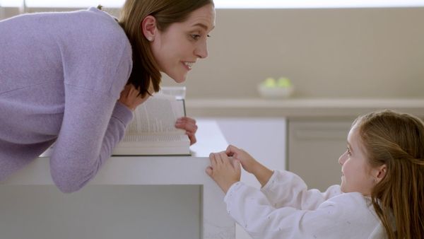 Bosch dishwasher mom talking to daughter and smiling