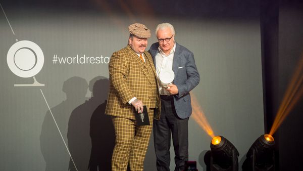 Alain Ducasse accepts his award from Matty Matheson