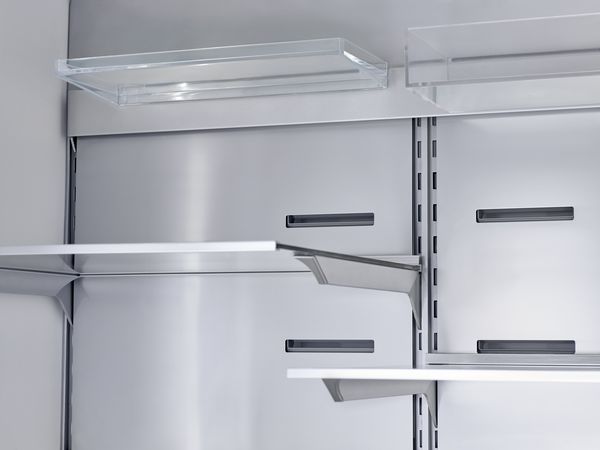 Empty stainless steel refrigerator back wall