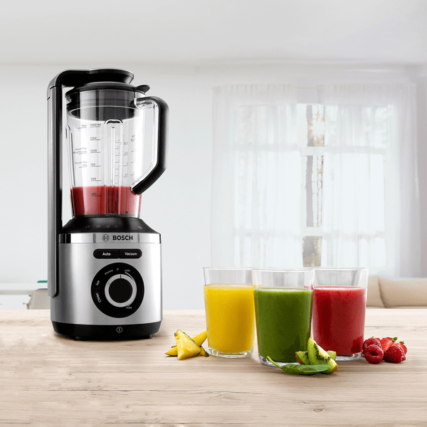 VitMaxx blender and accessories on kitchen top with fruit and smoothies.
