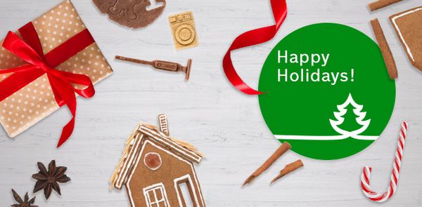 Collection of presents with a sticker displaying 'Happy Holidays'