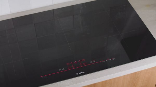 800 Series Induction Cooktop 36'' Black, surface mount with frame NIT8660SUC NIT8660SUC-12