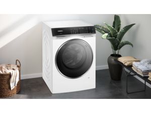 Bosch Series 4 -pesukone-kuivausrummun etunäkymä, valkoinen ulkoasu, pyöreä ovi ja digitaalinen ohjauspaneeli.