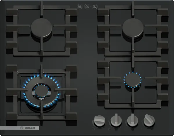 Black gas stovetop with five burners, including one larger burner with blue flame, and silver control knobs at the bottom.